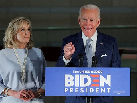 Democratic US presidential candidate and former Vice-President Joe Biden speaks with his wife Jill at his side during a primary night speech at The National Constitution Center in Philadelphia, Pennsylvania, on March 10.