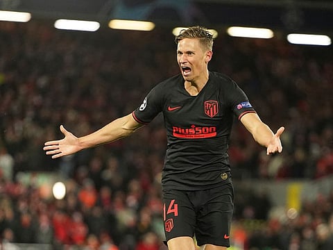 Atletico Madrid's Marcos Llorente celebrates after scoring his side's second goal.