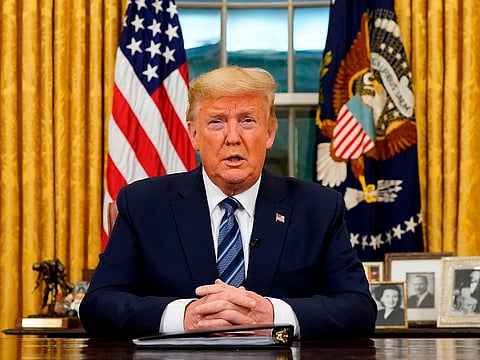 US President Donald Trump addresses the nation from the Oval Office about the widening novel coronavirus crisis in Washington, DC on March 11, 2020.