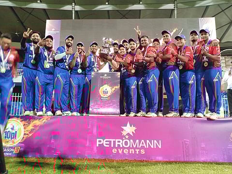 India, winners in the tennis ball cricket game against Pakistan, line up at Sharjah Cricket Stadium.
