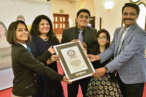 Manoj Varghese and his family members with the Guinness World Records citation