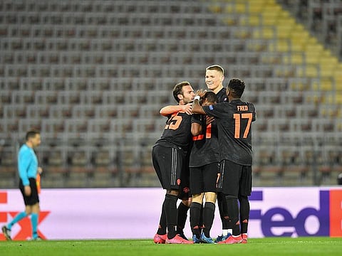 Manchester United's Daniel James celebrates with his teammates after scoring during the Uefa Europa League last 16, first leg match against LASK. The match was held behind closed doors due to coronavirus COVID-19
