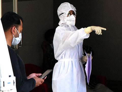 A medic wearing protective suit is seen outside an isolation ward, set up in view of coronavirus pandemic, at Aluva Government General Hospital in Kochi on March 15.