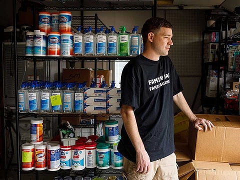 An Amazon merchant, Matt Colvin, with an overflow stock of cleaning and sanitizing supplies in his garage.