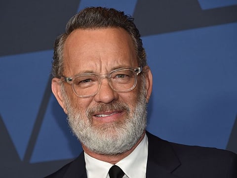(FILES) In this file photo US actor Tom Hanks arrives to attend the 11th Annual Governors Awards gala hosted by the Academy of Motion Picture Arts and Sciences at the Dolby Theater in Hollywood on October 27, 2019. March 11, 2020 Tom Hanks announces positive test for coronavirus. / AFP / Chris Delmas