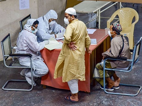Medics interact with Indonesian tourists at a Covid-19 helpdesk, in the wake of deadly coronavirus, at Hyderabad Gandhi Hospital on March 16.