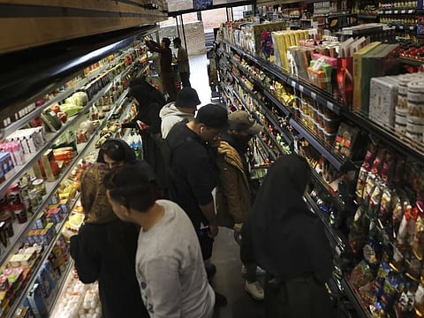 People shop at a grocery in Bamland shopping mall, in Western Tehran, Iran on March 15.