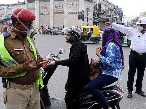 Policemen wear protective masks in wake of coronavirus, in Lucknow, on March 16, 2020