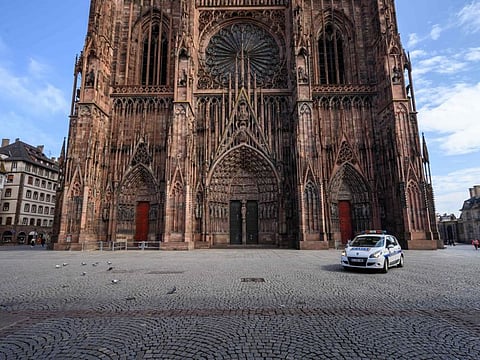 A police car patrols on the Cathedral square in Strasbourg, eastern France, on March 17, 2020 as the order of staying at home to all French citizens comes into effect, in order to avoid the spreading of the novel coronavirus (COVID-19).