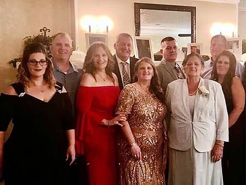 Grace Fusco, center, and her 11 children in a family photo.