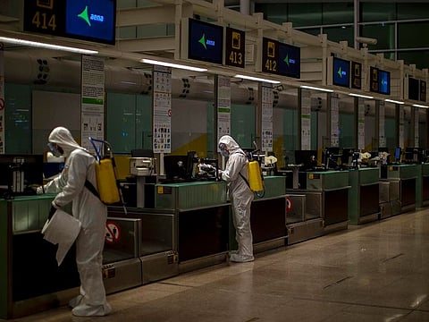 Spanish UME (Emergency Army Unit) soldiers disinfect the terminal to prevent the spread of COVID-19 at the airport of Barcelona, Spain, Thursday, March 19, 2020.