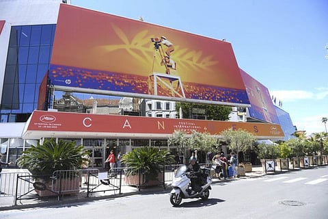 FILE - This May 13, 2019 file photo shows a view of the Palais des festivals during the 72nd international film festival, Cannes, southern France. Arguably the world’s most prestigious film festival and cinema’s largest annual gathering has postponed its 73rd edition. Organizers of the French Riviera festival, scheduled to take place May 12-23, said they are considering moving the festival to the end of June or the beginning of July. (Photo by Arthur Mola/Invision/AP, File)