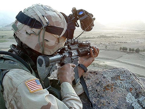 A US soldier keeps a close look out for suspected Taliban fighters in violence-wracked Zabul province some 300 kms southwest of the Afghan capital Kabul on September 5, 2003.