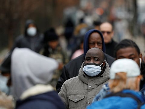 People queue to enter a tent erected to test for the coronavirus disease (COVID-19) at the Brooklyn Hospital Center in Brooklyn, New York City, on March 19, 2020.