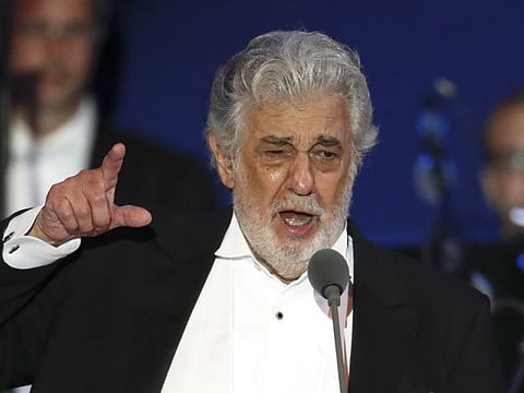 ** HOLD FOR STORY ** FILE- In this Aug. 28, 2019, file photo, opera singer Placido Domingo performs during a concert in Szeged, Hungary. (AP Photo/Laszlo Balogh, File)