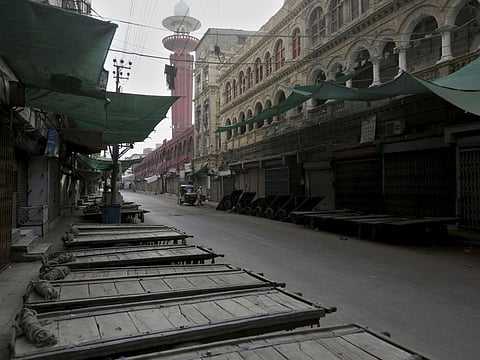 A view of a downtown market is seen empty during restrictions due to COVID-19 situation in Karachi, Pakistan, Pakistan, March 20, 2020. The vast majority of people recover from the new coronavirus. According to the World Health Organization, most people recover in about two to six weeks, depending on the severity of the illness. (AP Photo/Fareed Khan)