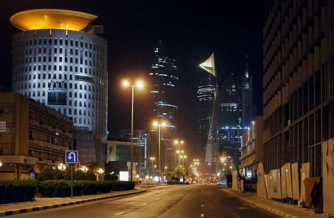 A photo taken on March 22 shows a deserted street in Kuwait city amid the COVID-19 pandemic. Kuwait imposed a curfew nationwide starting on Sunday at 5pm until 4am to fight the spread of the coronavirus.
