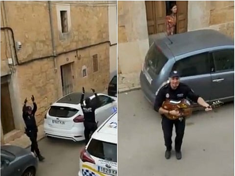 Police officers sing and dance on streets in Spain
