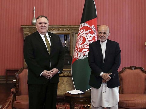 US Secretary of State Mike Pompeo, left, stands with Afghan President Ashraf Ghani, at the Presidential Palace in Kabul, Afghanistan, Monday, March 23, 2020.