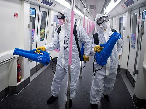 Illustrative image: Workers disinfect a subway train in preparation for the restoration of public transport in Wuhan, in central China's Hubei province.