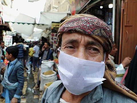 A man wears a protective face mask amid fears of the spread of the coronavirus disease (COVID-19), at a market in the old quarter Sanaa, Yemen, on March 18, 2020.