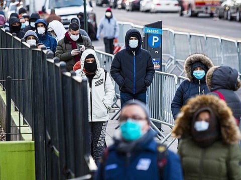 People line up to get a test at Elmhurst Hospital due to coronavirus outbreak on March 24, 2020 in Queens, New York, United States.