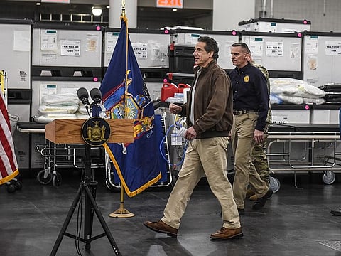 New York Gov. Andrew Cuomo prepares for a news conference at the Javits Center in New York, Tuesday, March 24, 2020, where the Army Corps of Engineers is turning the convention center into a 1,000-bed emergency hospital.