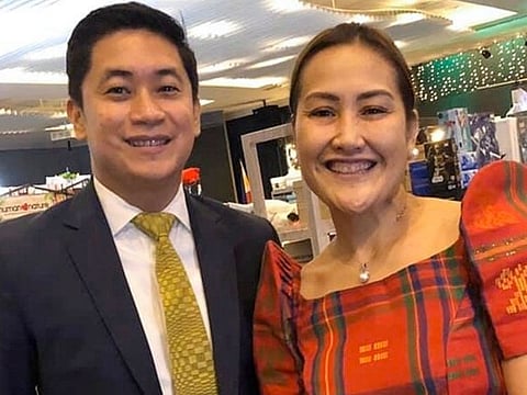 In this late February 2020, photo, Carlo Navarro poses with his wife Evie Navarro for a family photo during a trip to Tokyo. Days after he was cleared and discharged from hospital, Carlo Navarro shared his COVID-19 experience on a Facebook public post.