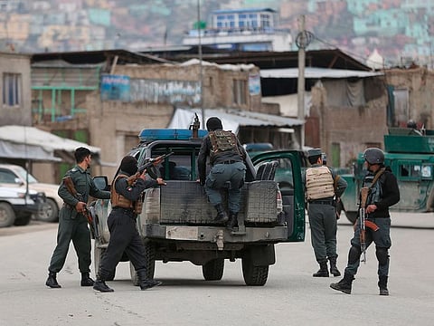Afghan personnel arrive at the site of an attack in Kabul, Afghanistan, Wednesday, March 25, 2020.