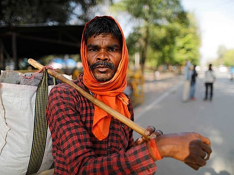 Hiralal, a daily wage labourer, leaves for his village as the city comes under lockdown in Prayagraj, India , on Thursday, March 26, 2020. Some of India's legions of poor people suddenly thrown out of work by a nationwide stay-at-home order began receiving aid distribution Thursday, as both the public and private sector work to blunt the impact of efforts to curb the coronavirus pandemic.