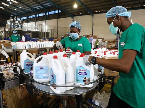 Employees inspect the production of hand sanitizers in Cormart factory as the company steps up production of hand sanitizers to prevent the spread of coronavirus disease (COVID-19), in the outskirts of Lagos, Nigeria on March 19, 2020.
