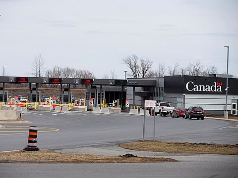 Cars drive through Canadian customs after movement restrictions came into effect due to coronavirus disease (COVID-19) in the border town of Cornwall, Ontario, Canada March 25, 2020.