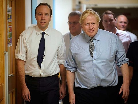 Britain's  Prime Minister Boris Johnson, right, and Health Minister Matt Hancock visit Bassetlaw District General Hospital on their General Election campaign in Worksop, England in November 2019.  Matt Hancock has tested positive for the new coronavirus, Friday March 27, 2020, the same day as Prime Minister Boris Johnson was confirmed to have COVID-19.