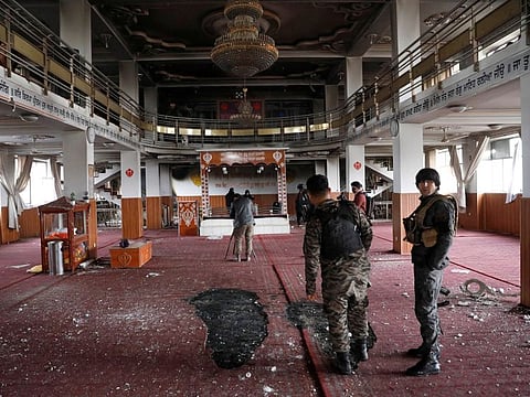 Afghan security personnel inspect inside a Sikh religious complex after an attack in Kabul, Afghanistan March 25, 2020.REUTERS/Mohammad Ismail