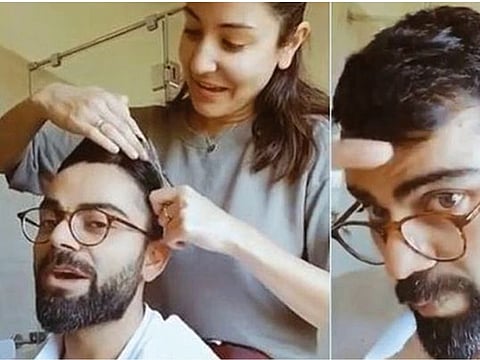 Virat Kohli, Indian cricket captain, enjoys a haircut by wife Anushka Sharma as they stay at home during the country-wide lockdown due to coronavirus pandemic.