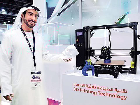 Dr Mohammad Al Redha, Director, Executive Office for Organisational Transformation, DHA, demos 3D printing