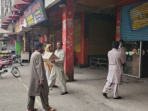 People get their grocery packs