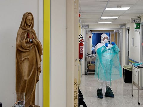 A medical worker in a protective suit is seen at the San Filippo Neri hospital, where patients suffering from the coronoavirus disease (COVID-19) are treated, in Rome, Italy, March 30, 2020.