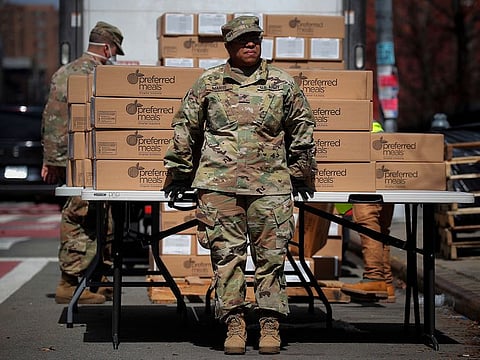 US Army National Guard personnel distribute free preferred meals to residents in the East Harlem section of Manhattan during the outbreak of the coronavirus disease (COVID-19) in New York City, New York, US
