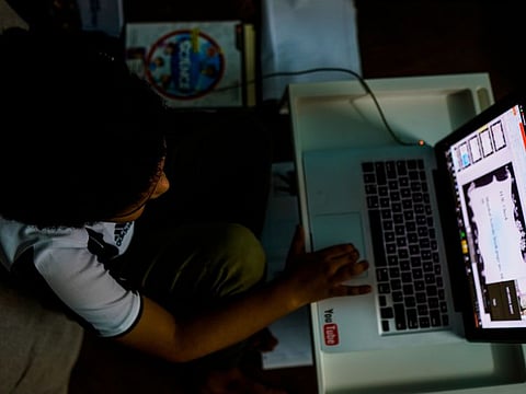 A student using their computer for e-learning