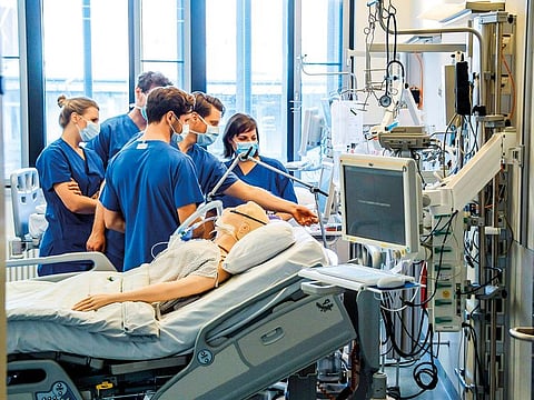 Illustrative purposes only: Doctors being instructed to handle a ventilator at a hospital in Hamburg.