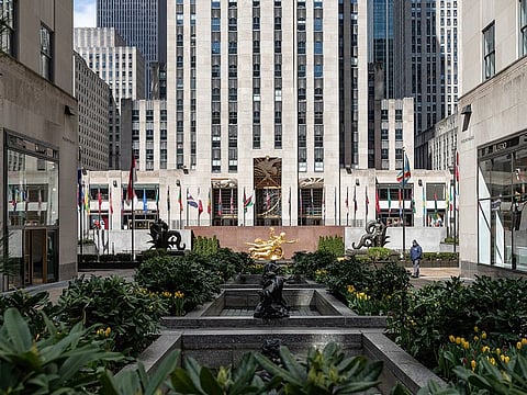 A security guard walks through Rockefeller Center in New York, U.S., on Wednesday, April 1, 2020.