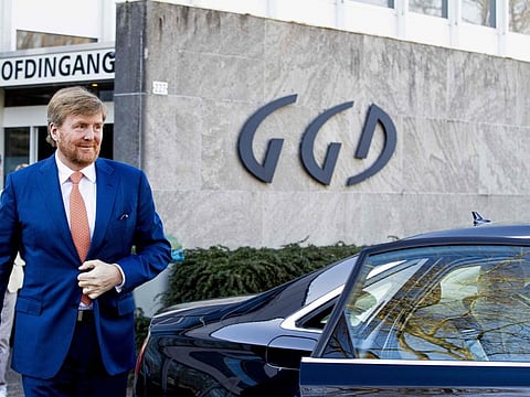 Dutch King Willem-Alexander walks to his car as part of a working visit to the Common health service (GGD) in Tilburg, The Netherlands, on March 24, 2020