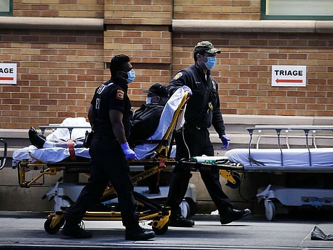 Medical workers bring in patients at a special coronavirus intake tent at Maimonides Medical Center in the Borough Park section of Brooklyn which has seen an upsurge of coronavirus patients in New York City