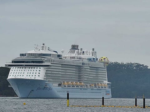 Cruise liner Spectrum of the Seas sits in Sydney Harbour after coming in to refuel and restock on April 3, 2020. Australia insisted on April 3, that it would not let the crews of multiple virus-stricken cruise ships into the country, slapping aside suggestions it was falling short on legal and moral obligations.