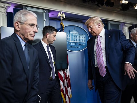 Anthony Fauci (left), director of the National Institute for Allergy and Infectious Diseases, attends a White House briefing with President Trump on April 1, 2020. He is one of the core members of the administration’s coronavirus task force. MUST CREDIT: Washington Post photo by Jabin Botsford.