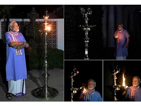 Narendra Modi lighting the lamp