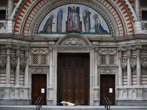 A homeless person sleeps in a doorway at Westminster Cathedral, as the spread of the coronavirus disease (COVID-19) continues, London, Britain, April 3, 2020