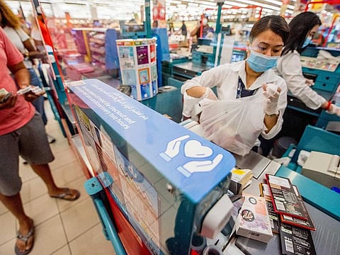 A safety message to sanitise your hands every two hours, displayed at a hypermarket till in the Mall of the Emirates in Dubai.