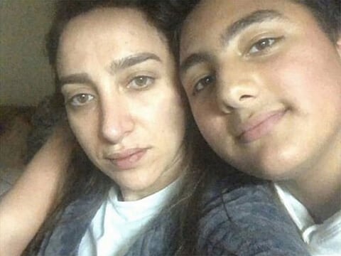 Eman and her son after she was rescued from her abusive family house